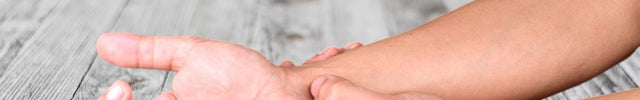 Hand massage on a wooden surface